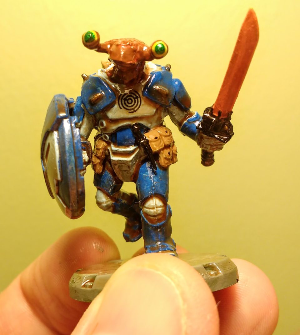 Front of a painted Dust Tactics NCO mechanic with an alien head