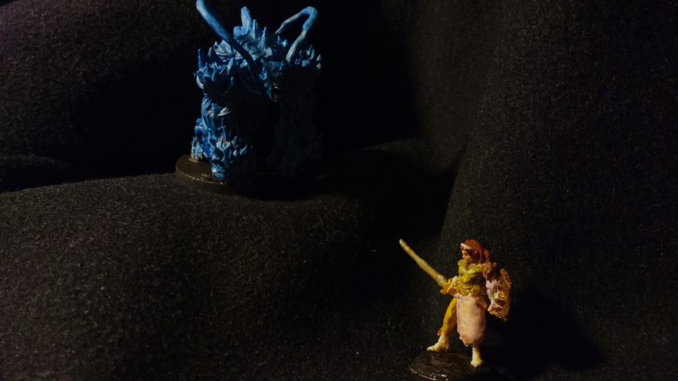 Two miniatures converted to resemble Alisa Landale and the Dark Force from the original Phantasy Star game.