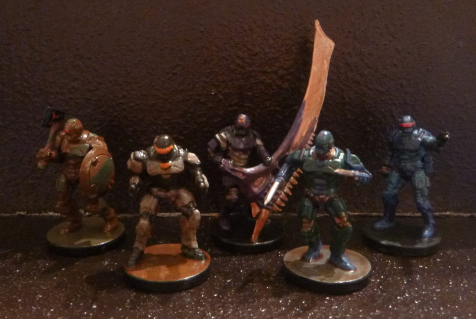 A group of five android miniatures