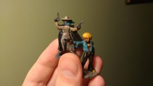 Two painted tabletop miniatures of Horace 'Action' Johnson and The Black Mist