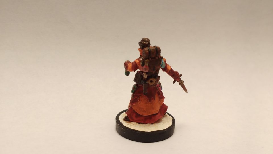 Damiel Iconic Alchemist miniature from Reaper Bones. Viewed from the back.