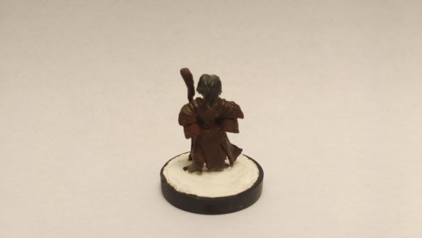 The Lem Iconic Bard miniature from Reaper Bones. Viewed from the back.