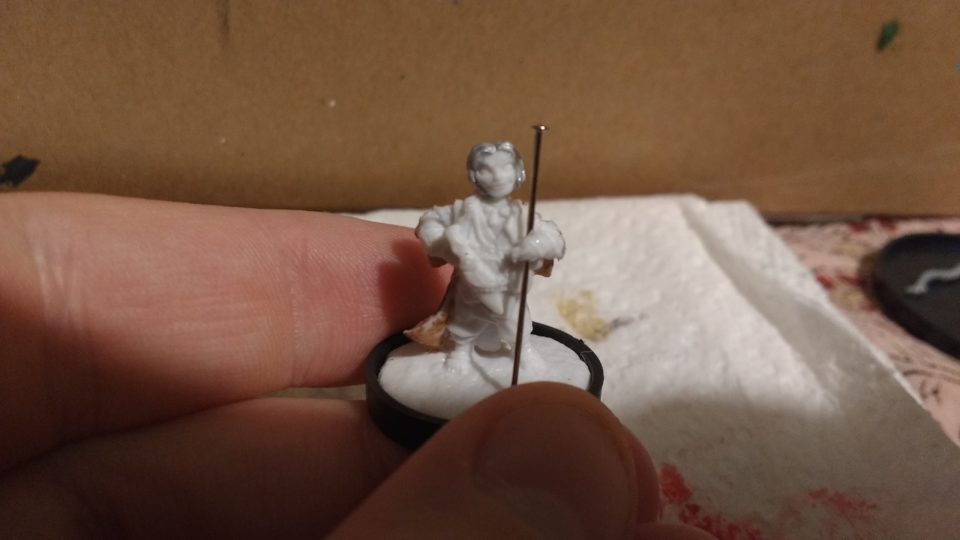 The Lem Iconic Bard miniature from Reaper Bones. The flute has been removed in this photo and a pin inserted in it's place.